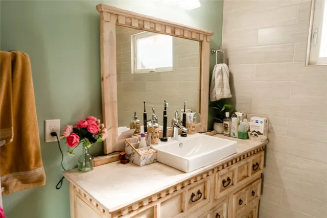 a bathroom with a bathtub and shower