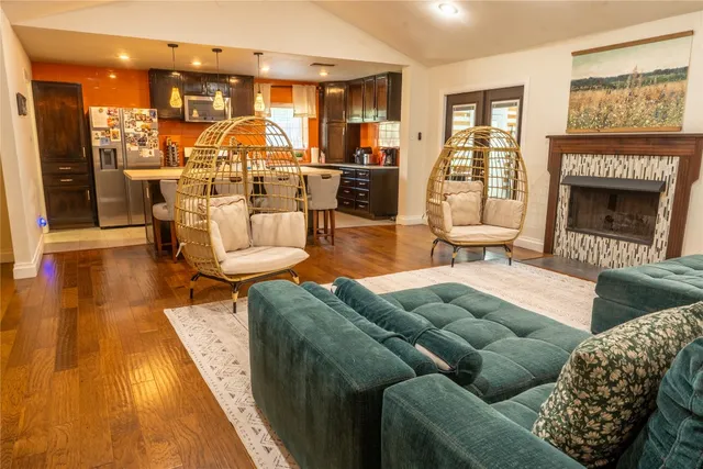 a living room with furniture and a fireplace
