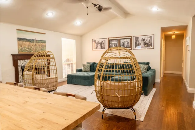 a bedroom with furniture and a wooden floor