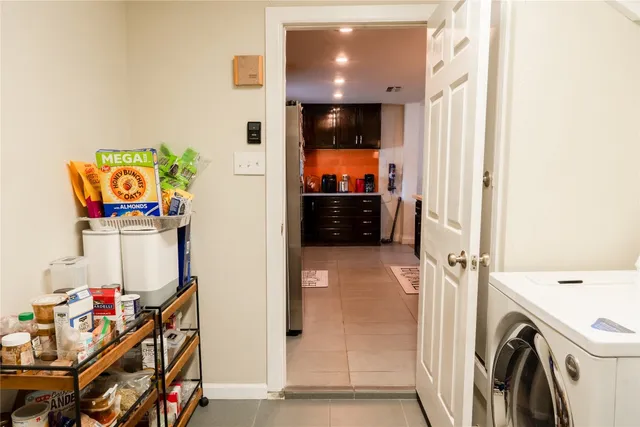 a view of hallway with washer and dryer