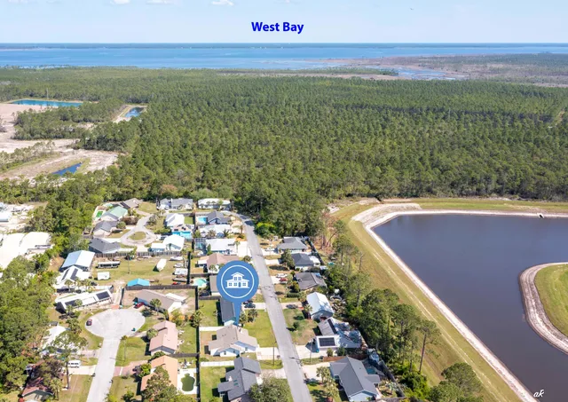 an aerial view of residential houses with outdoor space and swimming pool