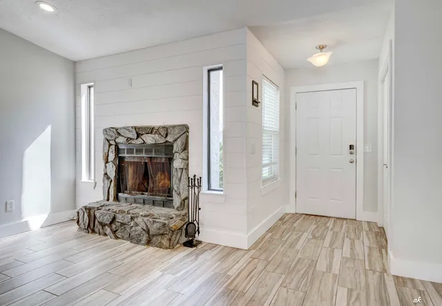 a view of fireplace with wooden floor