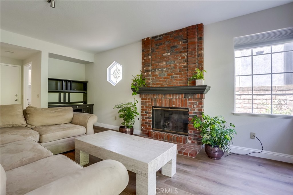 26511 Maside Mission Viejo, CA 92692 - Photo 15 of 46 a living room with furniture a window and a fireplace