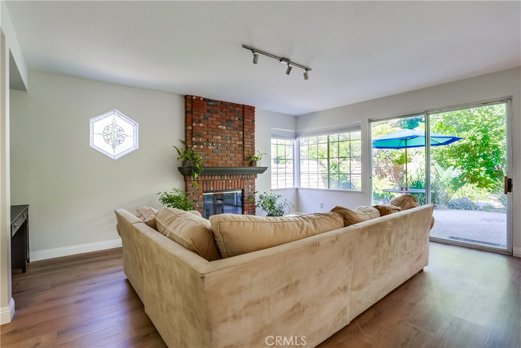 26511 Maside Mission Viejo, CA 92692 - Photo 16 of 46 a living room with fireplace furniture and a large window