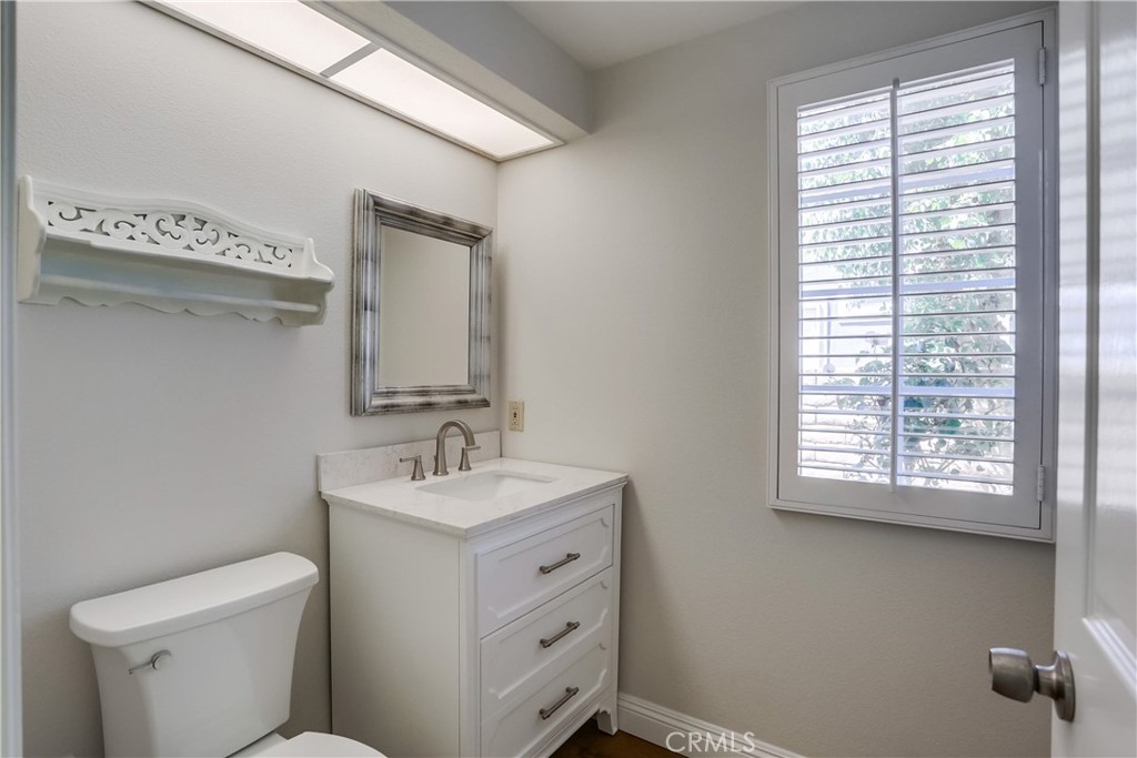 26511 Maside Mission Viejo, CA 92692 - Photo 17 of 46 a bathroom with a toilet sink and mirror