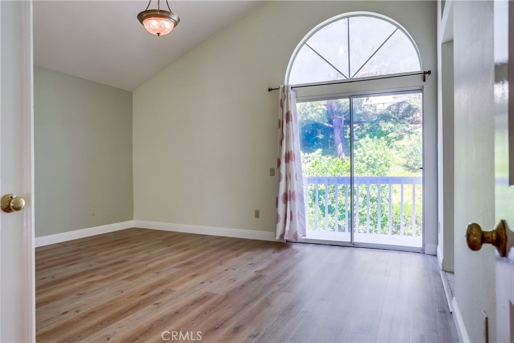 26511 Maside Mission Viejo, CA 92692 - Photo 20 of 46 an empty room with wooden floor fan and a window