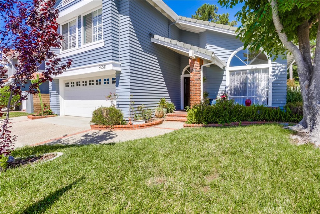 26511 Maside Mission Viejo, CA 92692 - Photo 2 of 46 a front view of a house with garden