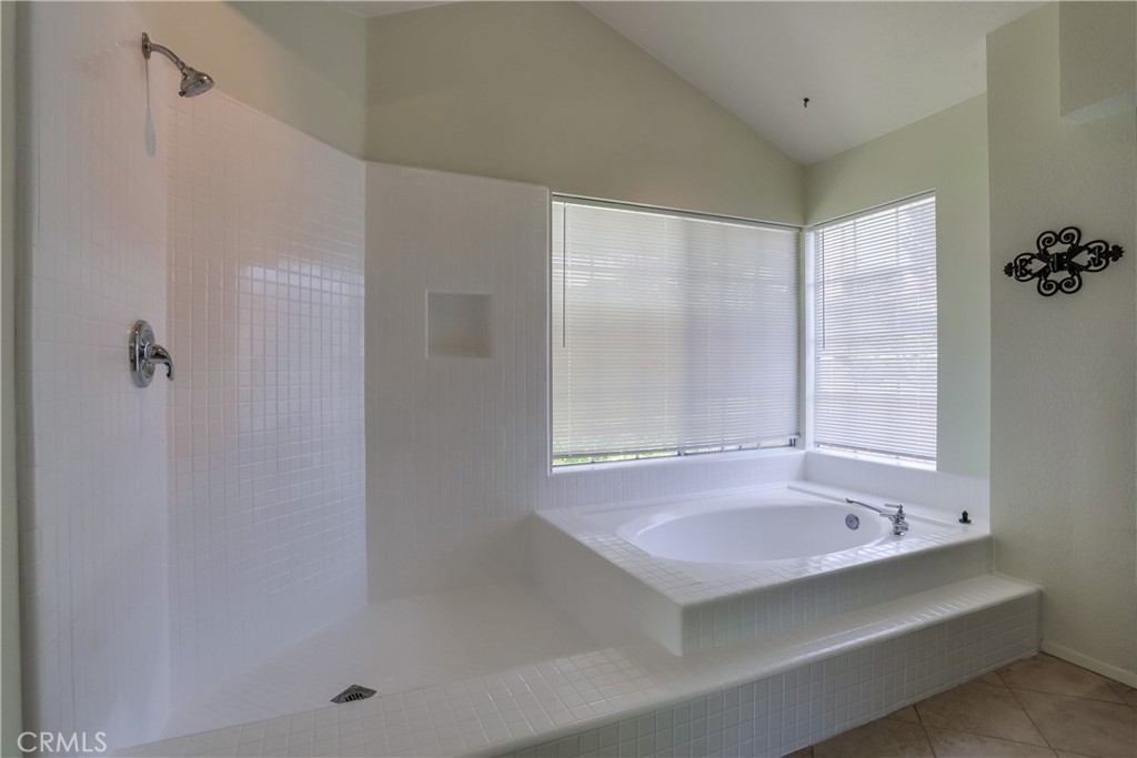 26511 Maside Mission Viejo, CA 92692 - Photo 24 of 46 a bathroom with a tub and a shower