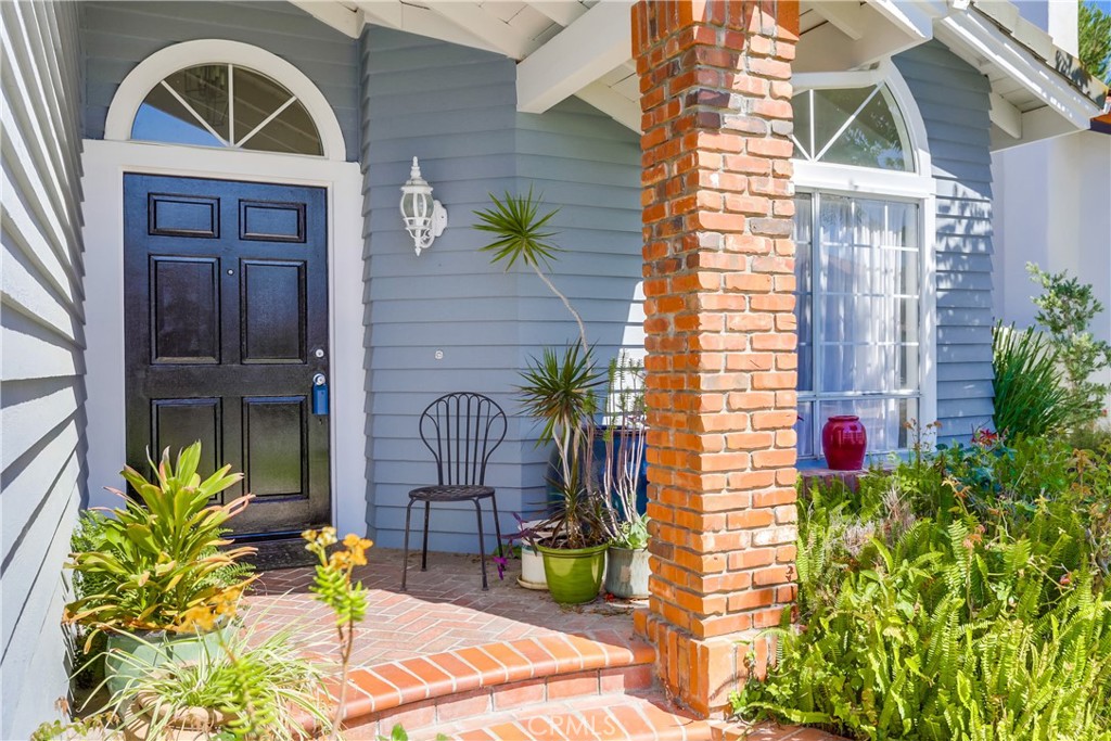 26511 Maside Mission Viejo, CA 92692 - Photo 3 of 46 a front view of a house with swimming pool