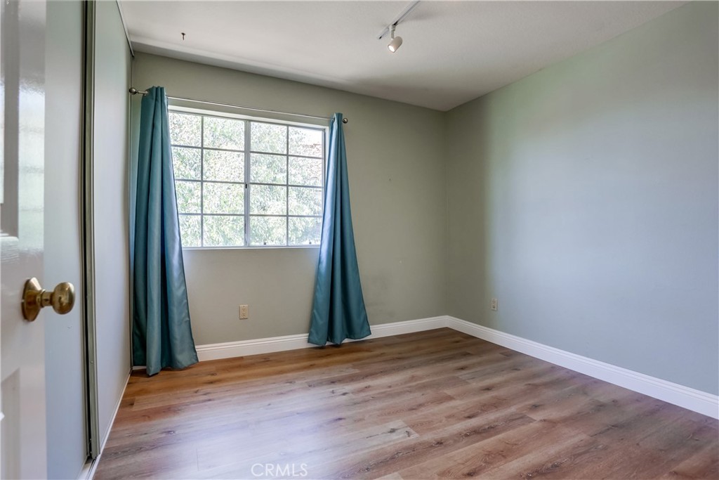 26511 Maside Mission Viejo, CA 92692 - Photo 32 of 46 an empty room with wooden floor and windows