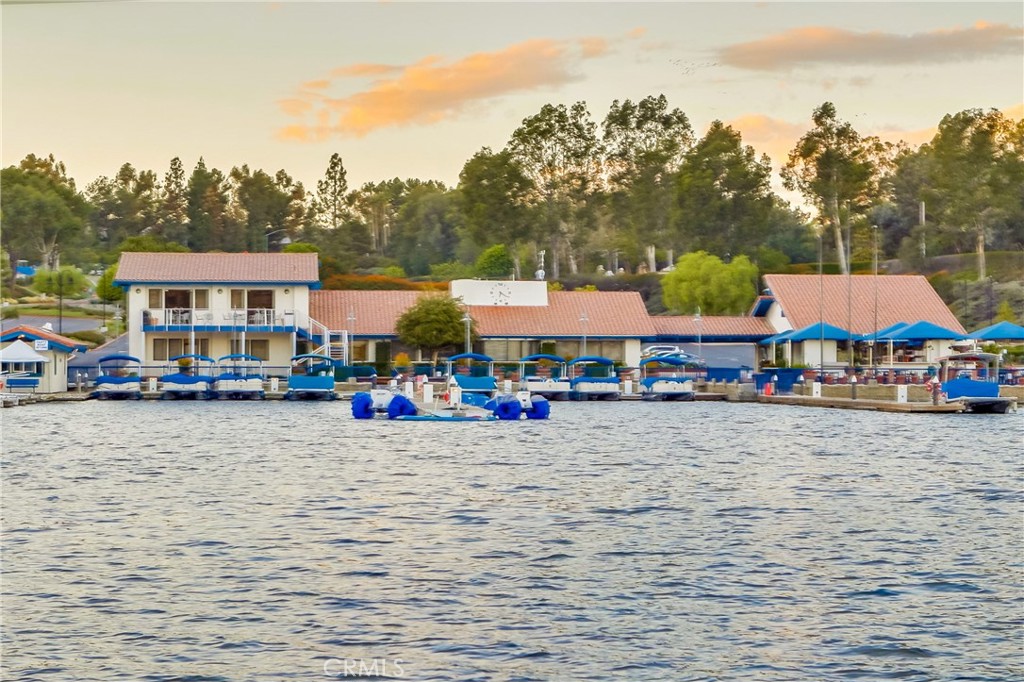 26511 Maside Mission Viejo, CA 92692 - Photo 44 of 46 a view of a lake with lawn chairs and large trees