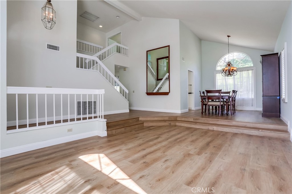 26511 Maside Mission Viejo, CA 92692 - Photo 5 of 46 a view of a livingroom with furniture stairs wooden floor and windows