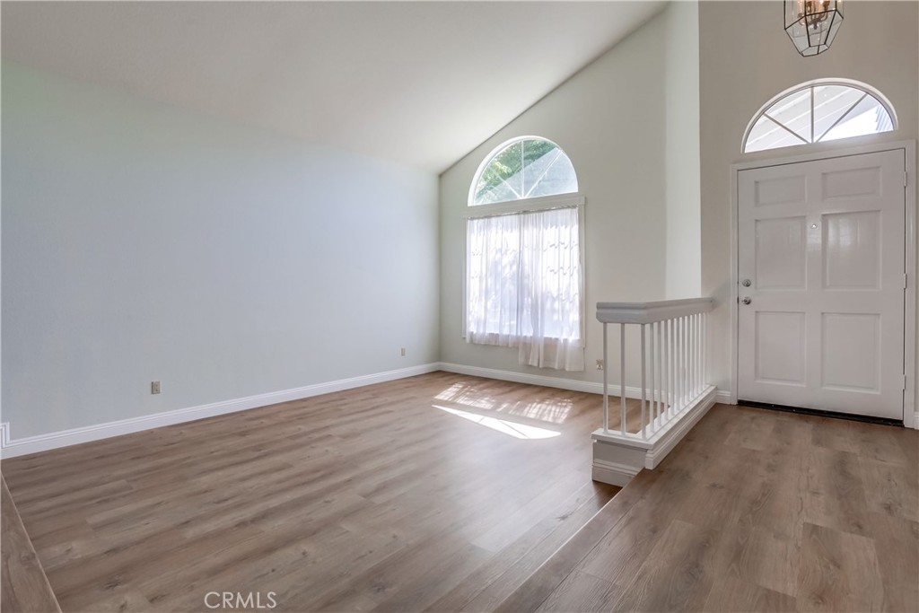 26511 Maside Mission Viejo, CA 92692 - Photo 6 of 46 an empty room with wooden floor and windows