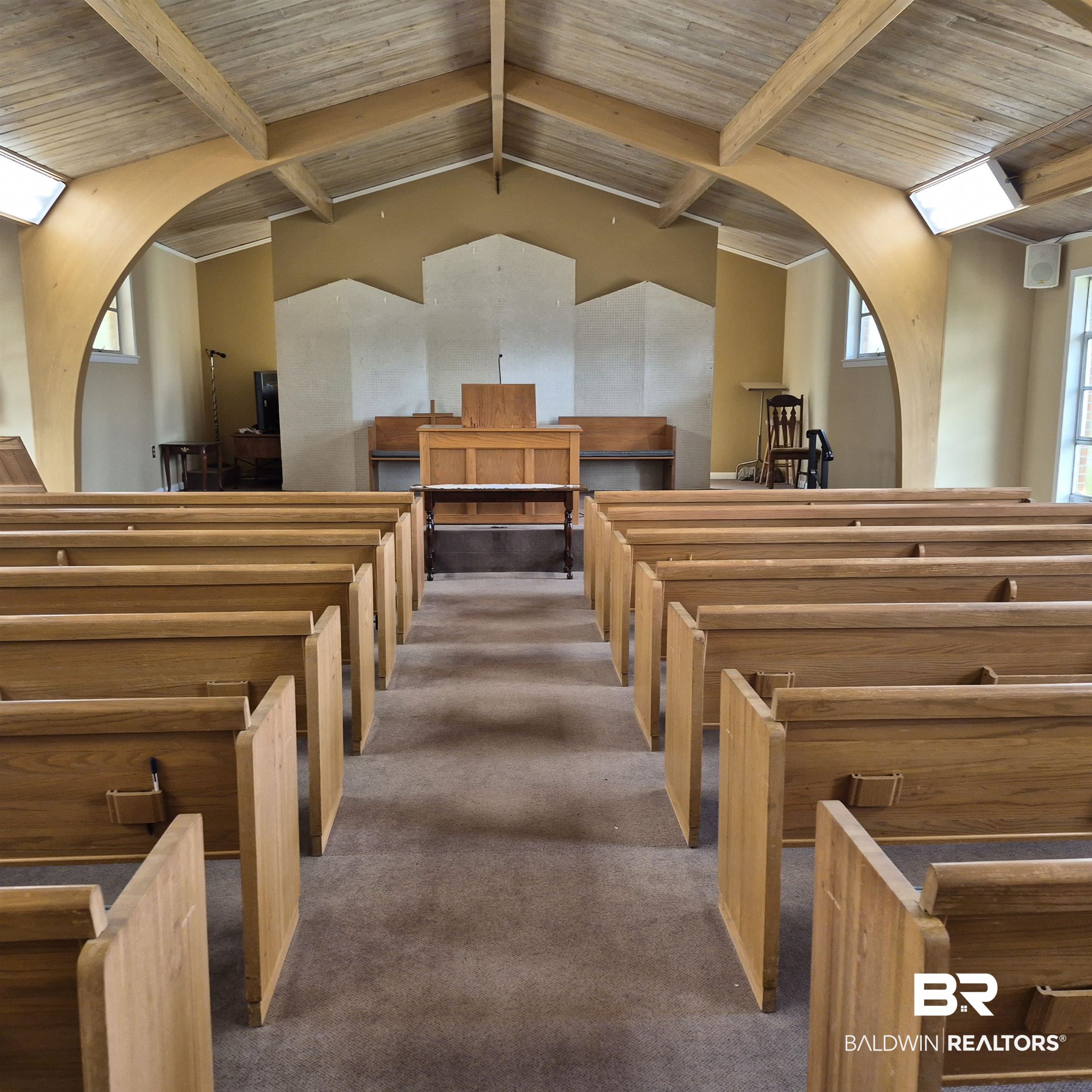 305 Rural Street Evergreen, AL 36401 - Photo 6 of 32 Misc room with arched walkways and a wooden ceiling with exposed beams