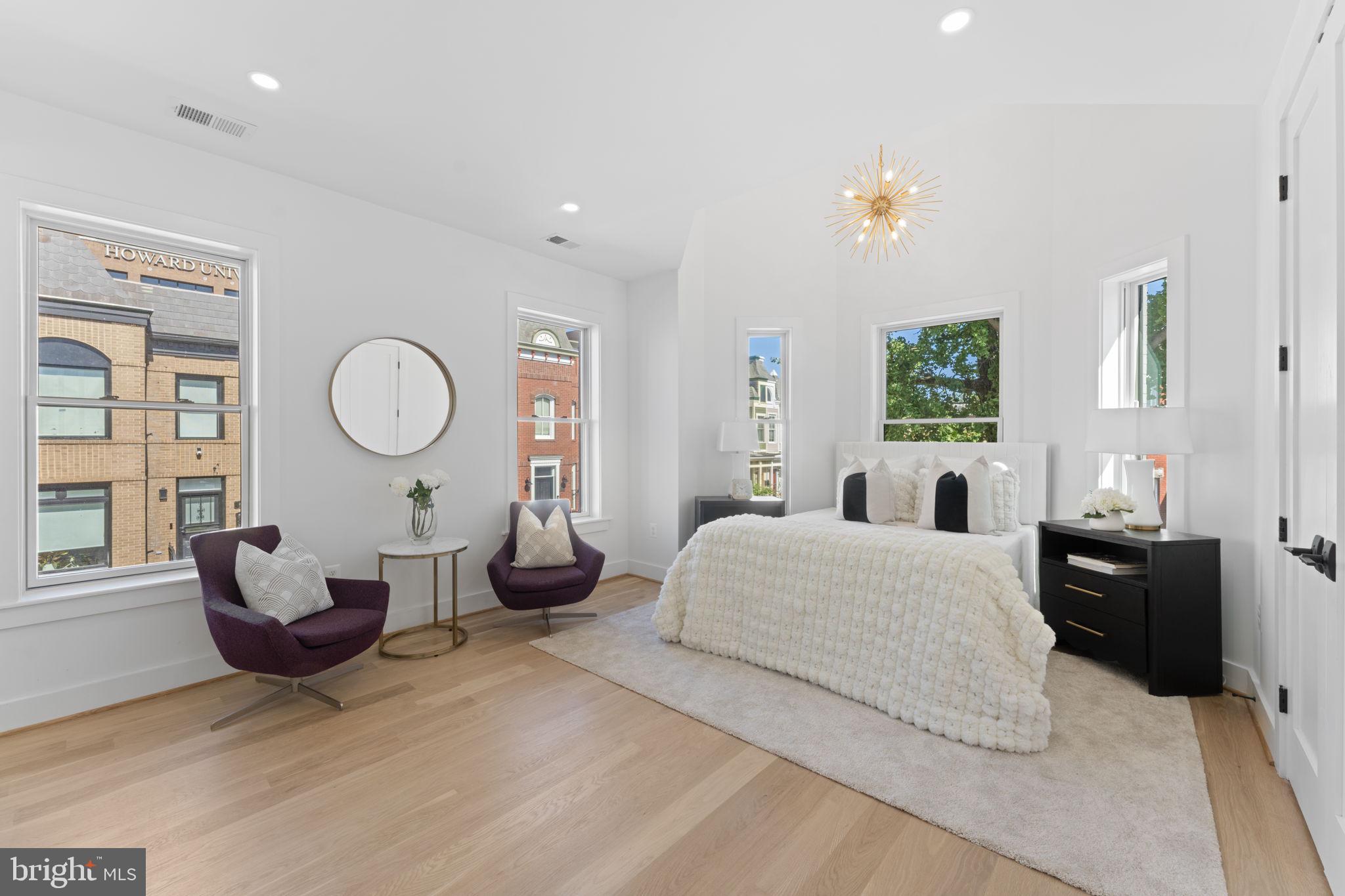 600 U Street Northwest Washington, DC 20001 - Photo 22 of 54 a living room with furniture chandelier and a large window