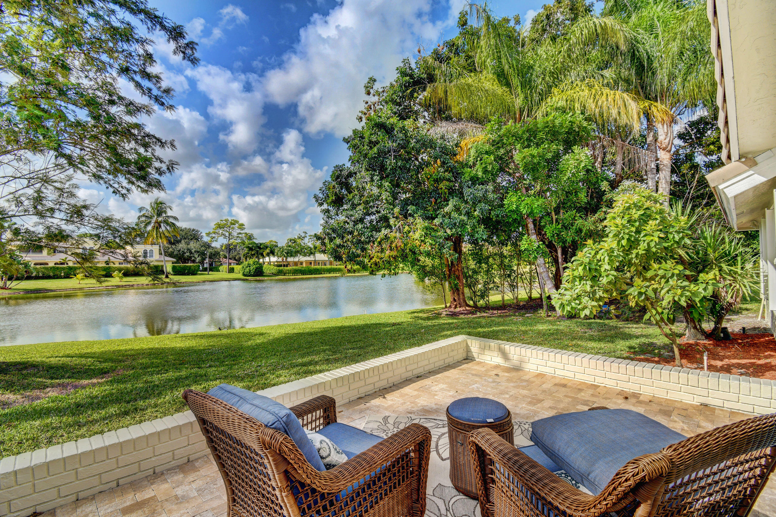 9305 Perth Road Lake Worth, FL 33467 - Photo 62 of 67 Side patio overlooking lake