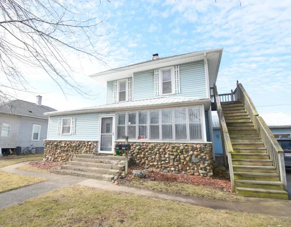 a front view of a house with garage