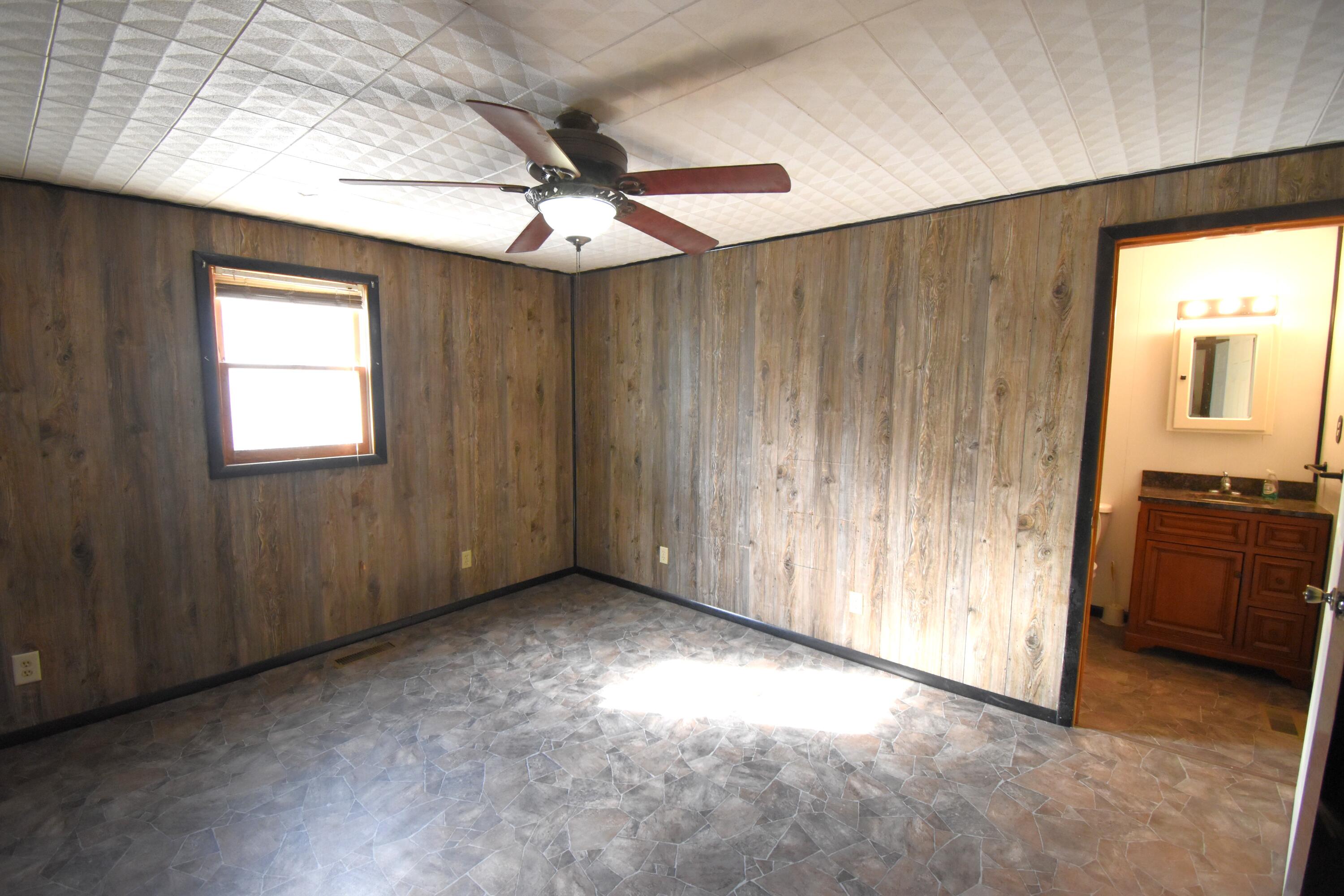 720 North Jefferson Street Rensselaer, IN 47978 - Photo 15 of 49 an empty room with windows and fan