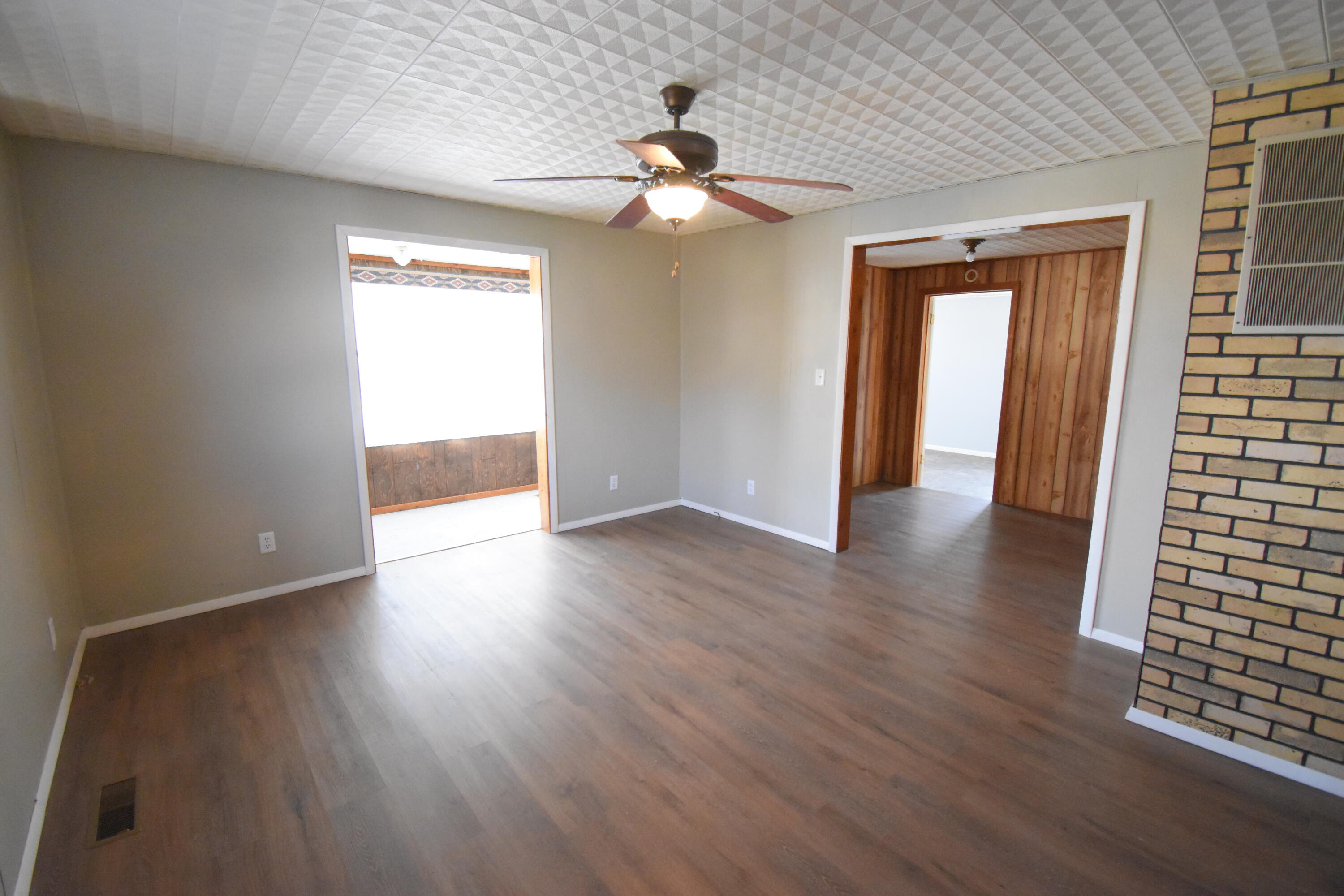 720 North Jefferson Street Rensselaer, IN 47978 - Photo 18 of 49 wooden floor in an empty room with a window