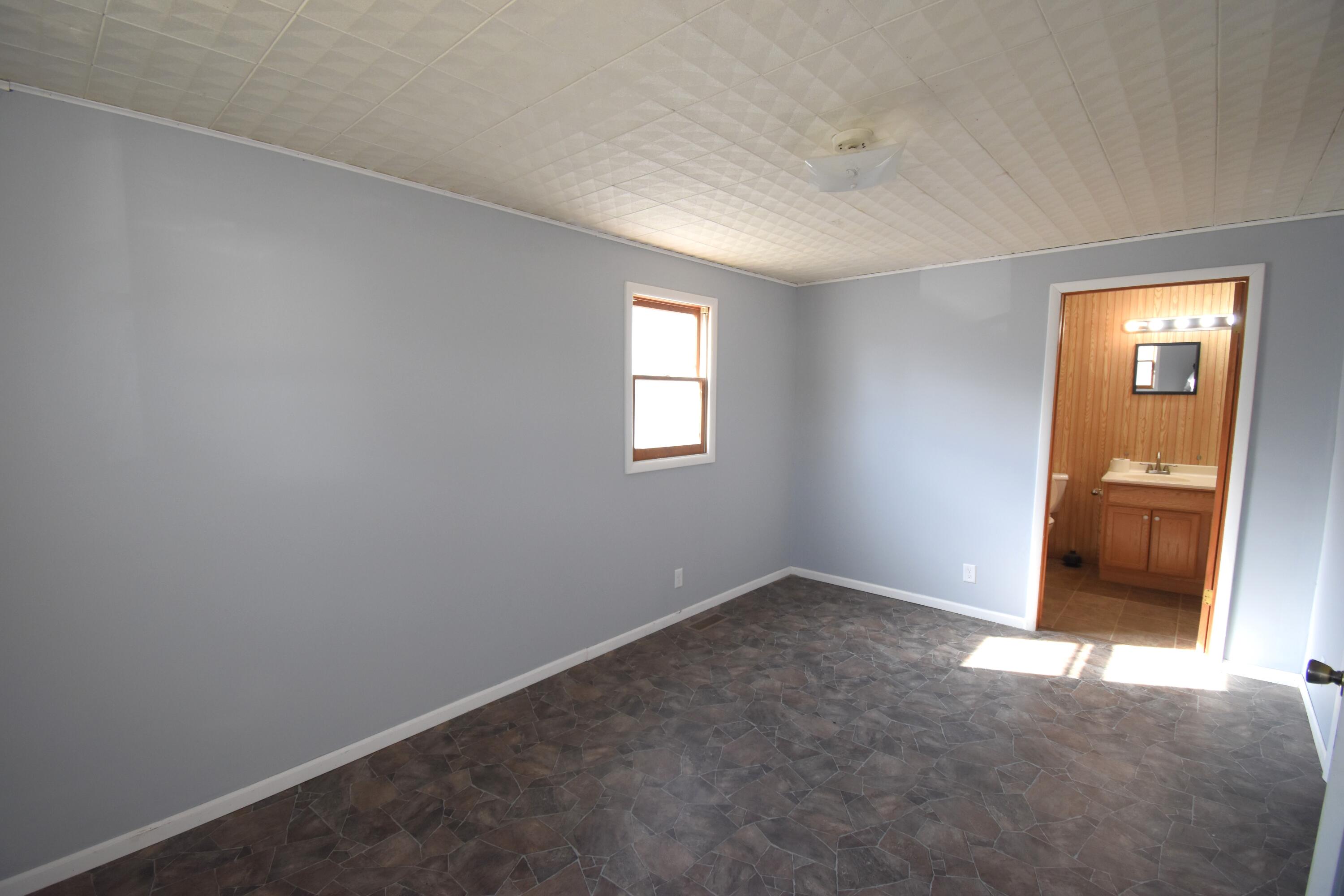 720 North Jefferson Street Rensselaer, IN 47978 - Photo 21 of 49 an empty room that has a window in it