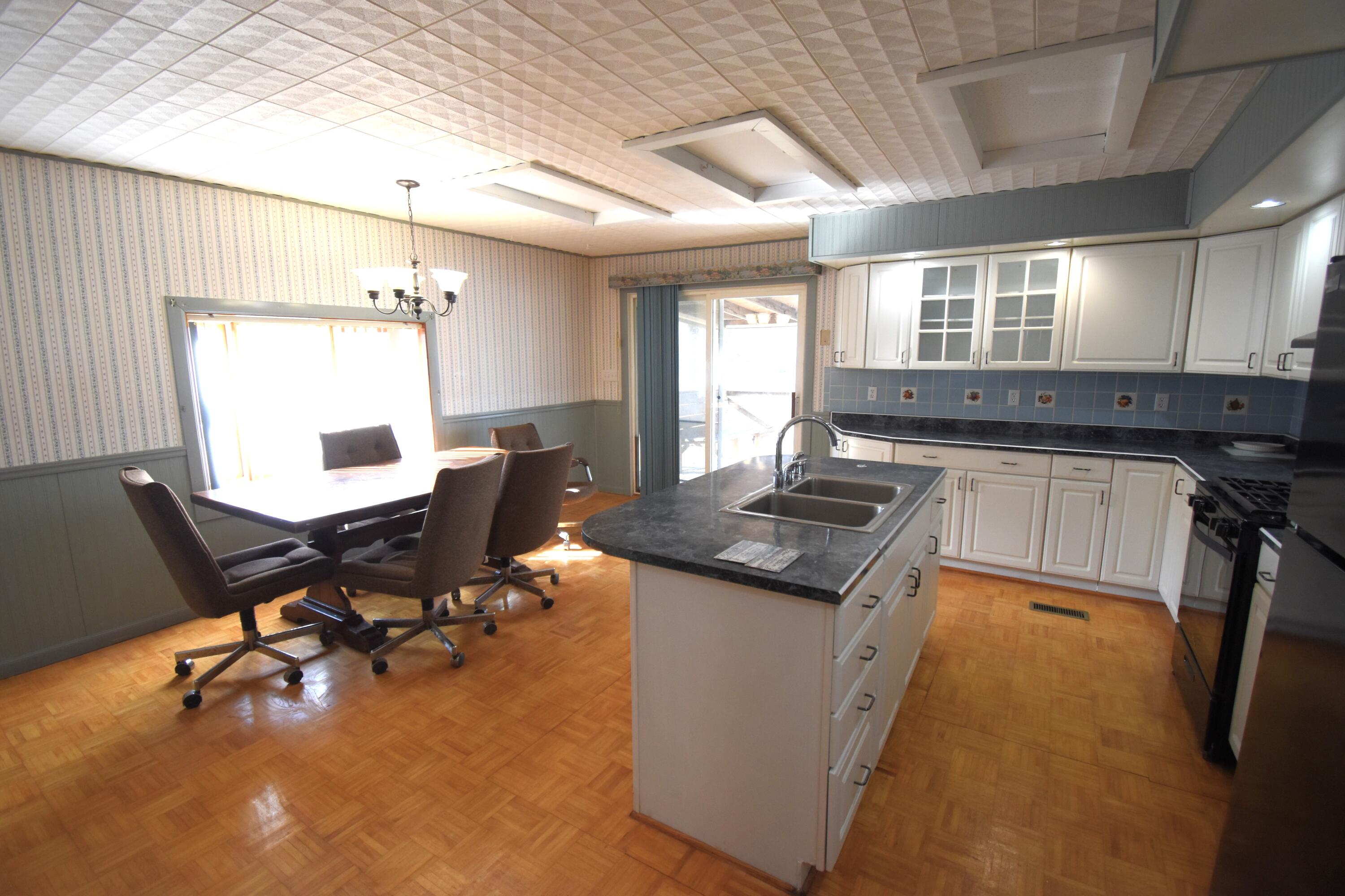 720 North Jefferson Street Rensselaer, IN 47978 - Photo 27 of 49 a kitchen with a sink a counter top space and appliances