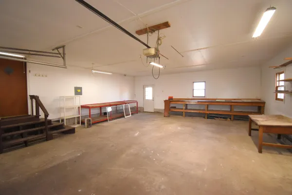 a living room with lots of furniture and a chandelier