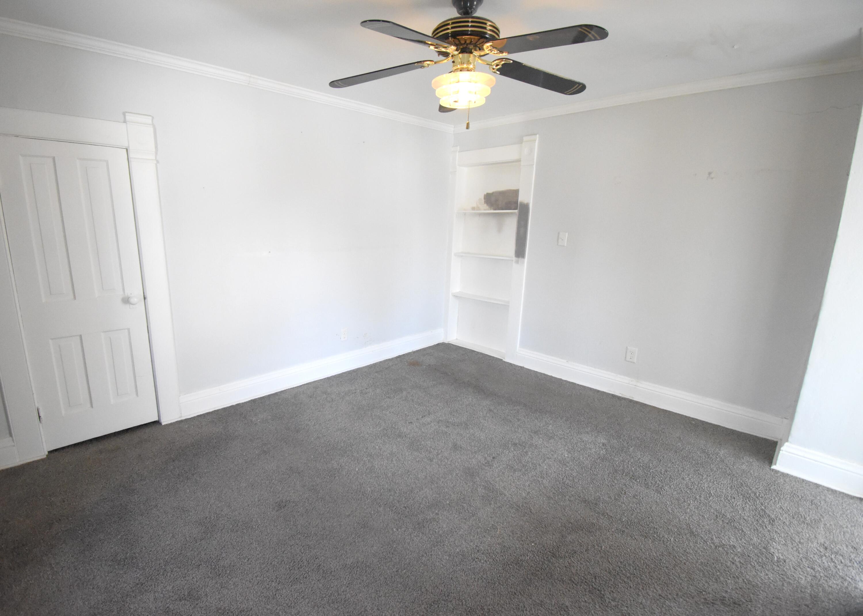 720 North Jefferson Street Rensselaer, IN 47978 - Photo 37 of 49 an empty room with a window and a fan