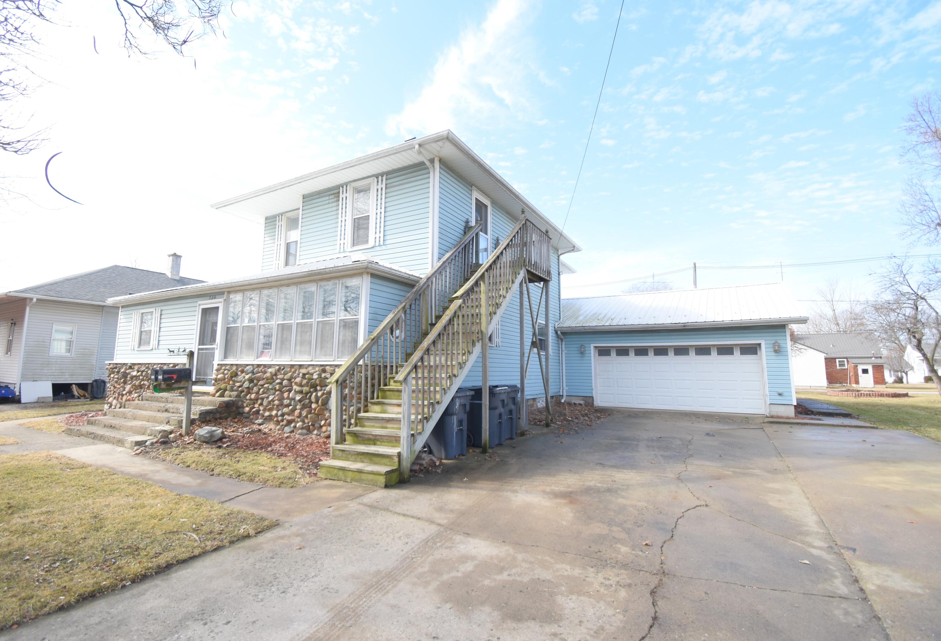 720 North Jefferson Street Rensselaer, IN 47978 - Photo 4 of 49 a view of a house with backyard and sitting area