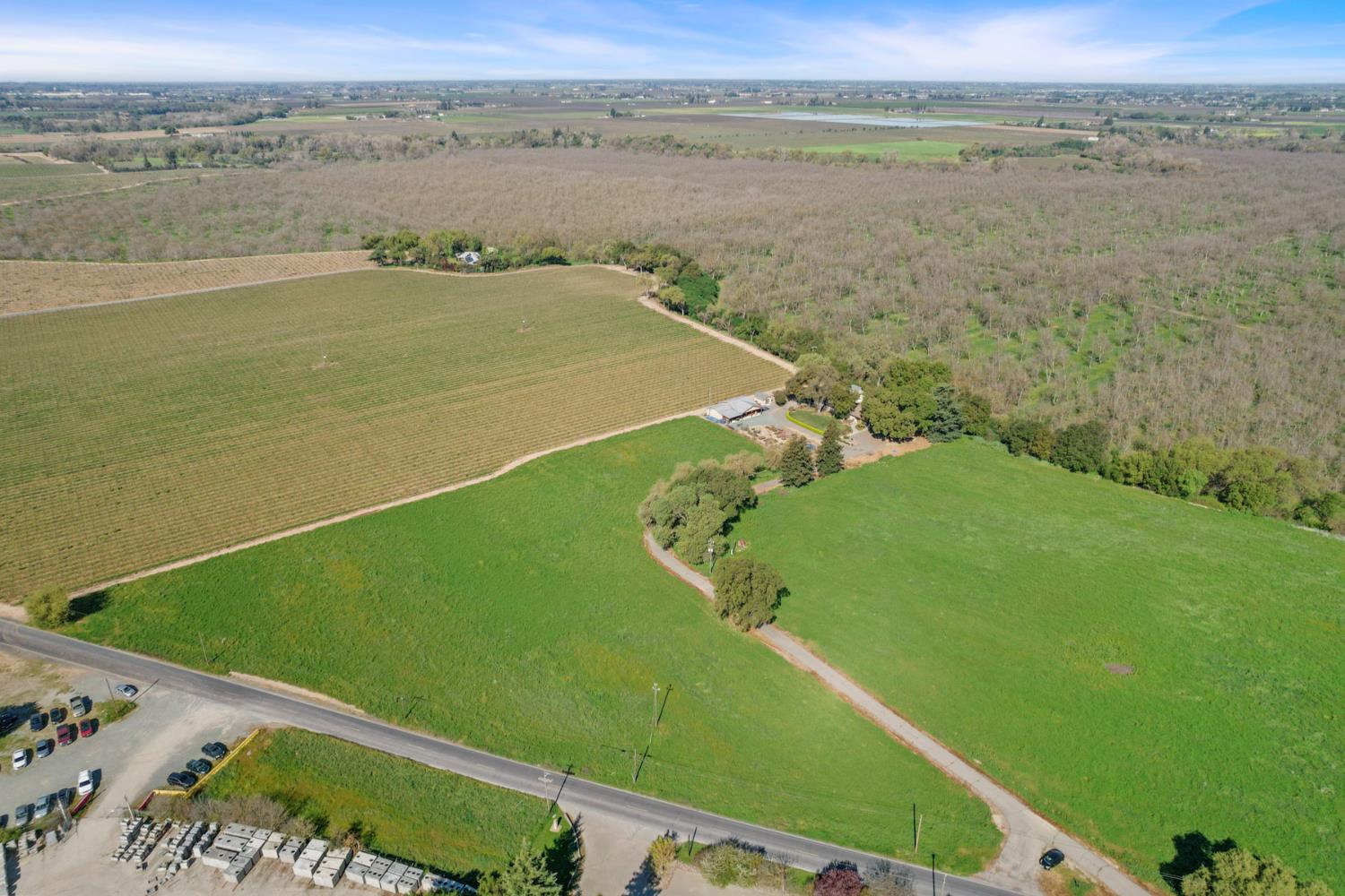 12521 Locke Road Lockeford, CA 95237 - Photo 17 of 24 a view of a lake with a yard