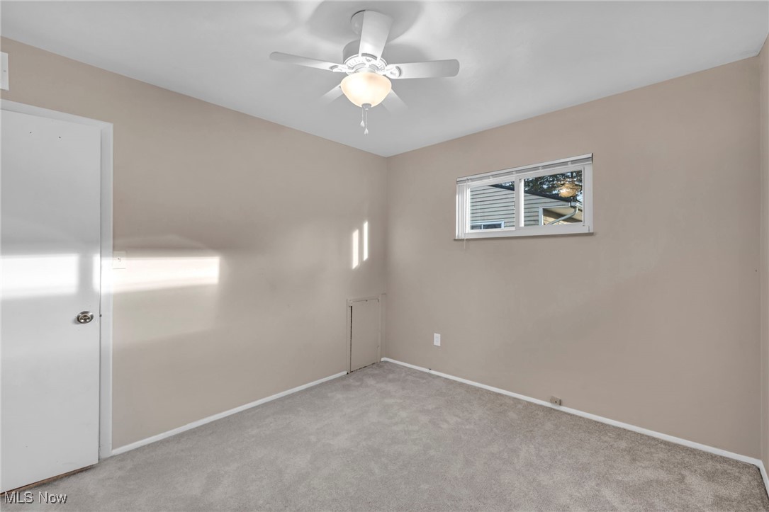 267 Barrett Road Berea, OH 44017 - Photo 33 of 41 Empty room with light carpet and ceiling fan