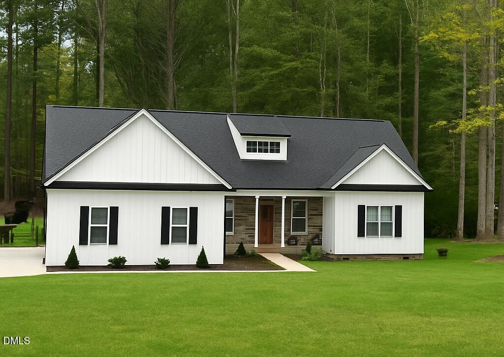 a view of a white house with a big yard and large trees