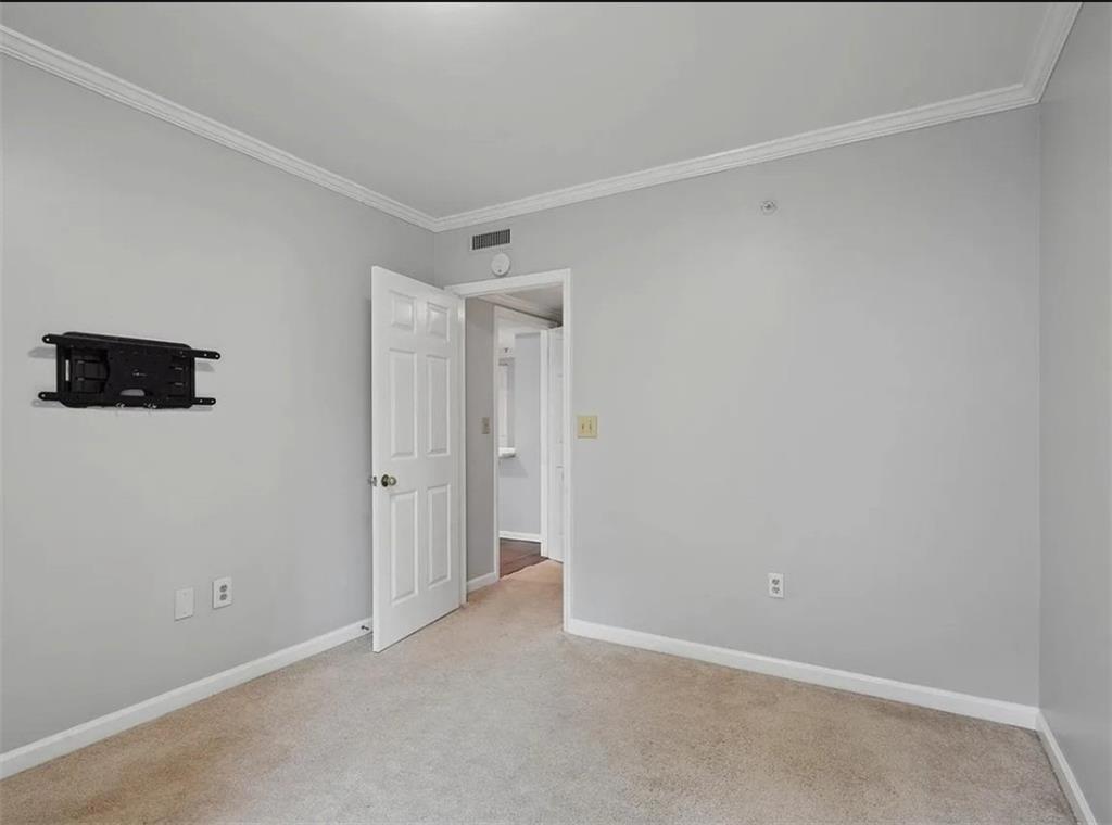 199 14th Street Northeast, Unit 210 Atlanta, GA 30309 - Photo 7 of 12 a view of an empty room