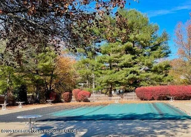 a backyard of a house with yard and outdoor seating