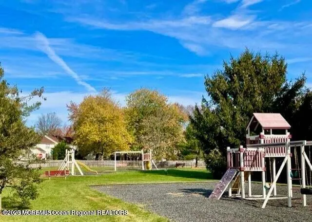 a view of a playground with basketball court