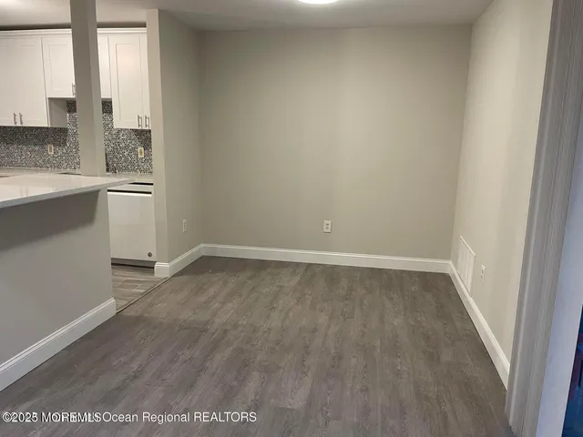 a view of a kitchen with a sink and dishwasher