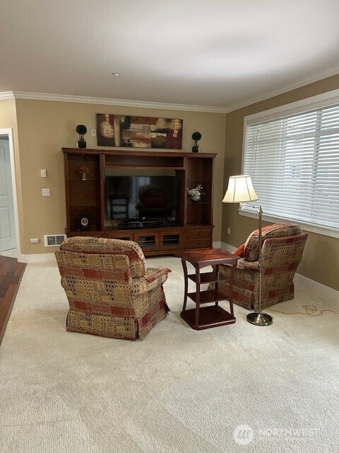 23943 Northeast 115th Lane, Unit 204 Redmond, WA 98053 - Photo 7 of 24 a living room with furniture a flat screen tv and a fireplace