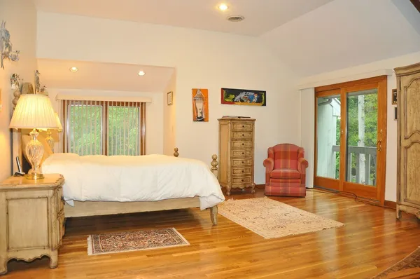 a bed room with a bed and a lamp