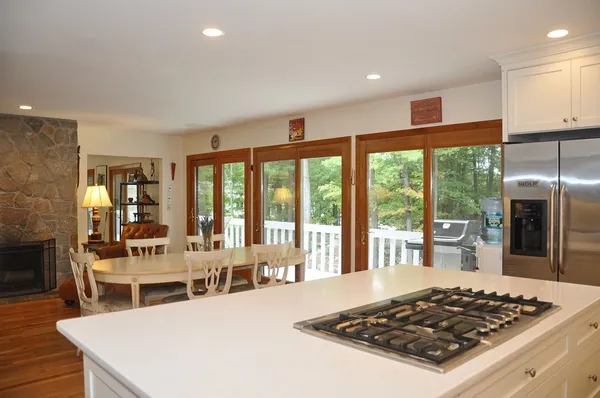 a kitchen with a stove a sink and a refrigerator