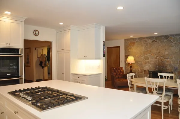 a kitchen with a table and chairs