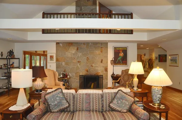 a living room with furniture and a fireplace