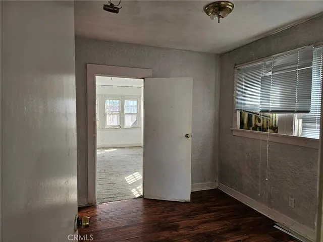 a bathroom with a shower curtain and a sink