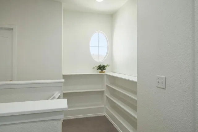 a view of a room with shelves