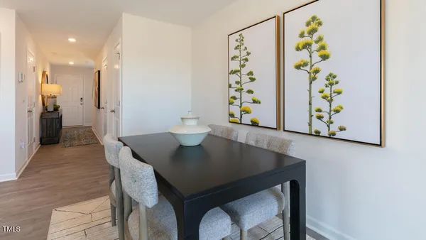 a view of a dining area with a table and chairs