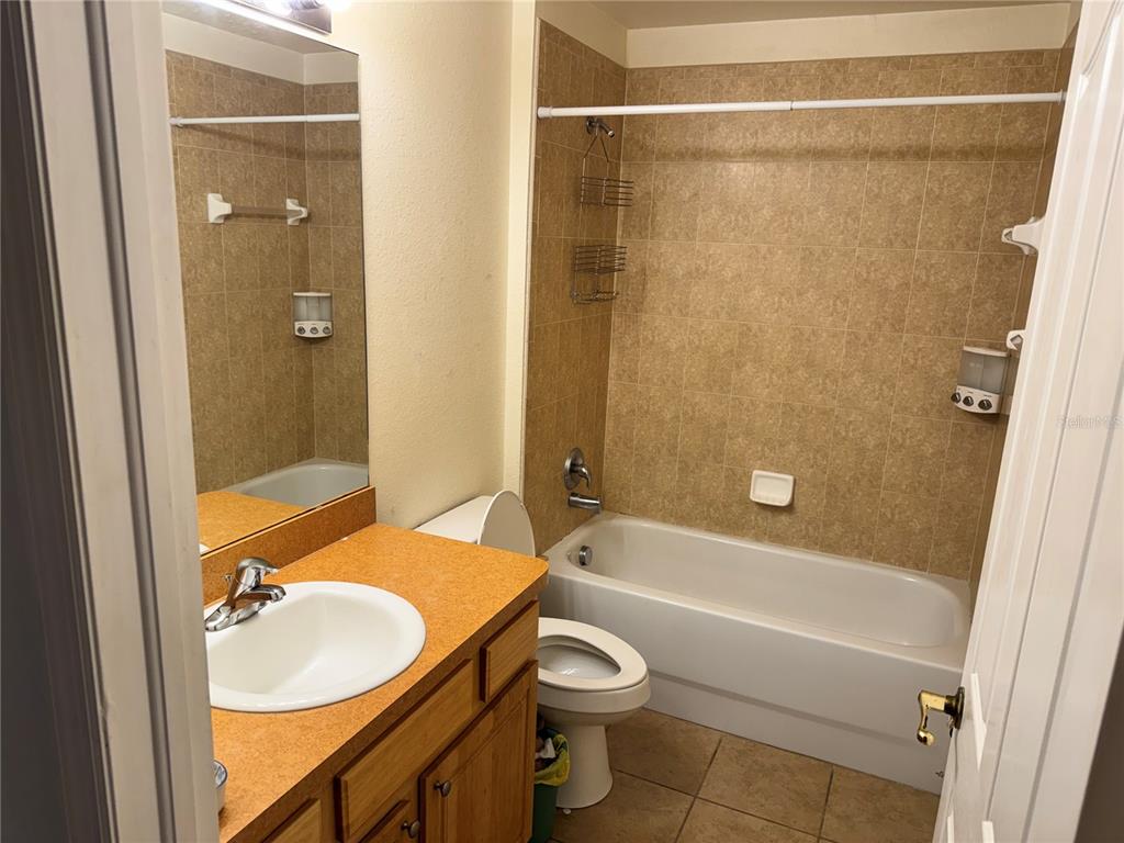 12055 Robina Road Weeki Wachee, FL 34614 - Photo 14 of 64 a bathroom with a sink toilet and shower