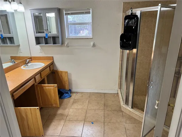 a view of a livingroom with a sink and dishwasher kitchen view