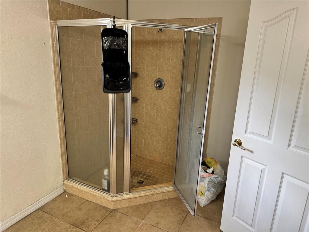 12055 Robina Road Weeki Wachee, FL 34614 - Photo 31 of 64 a bathroom with a shower and a sink