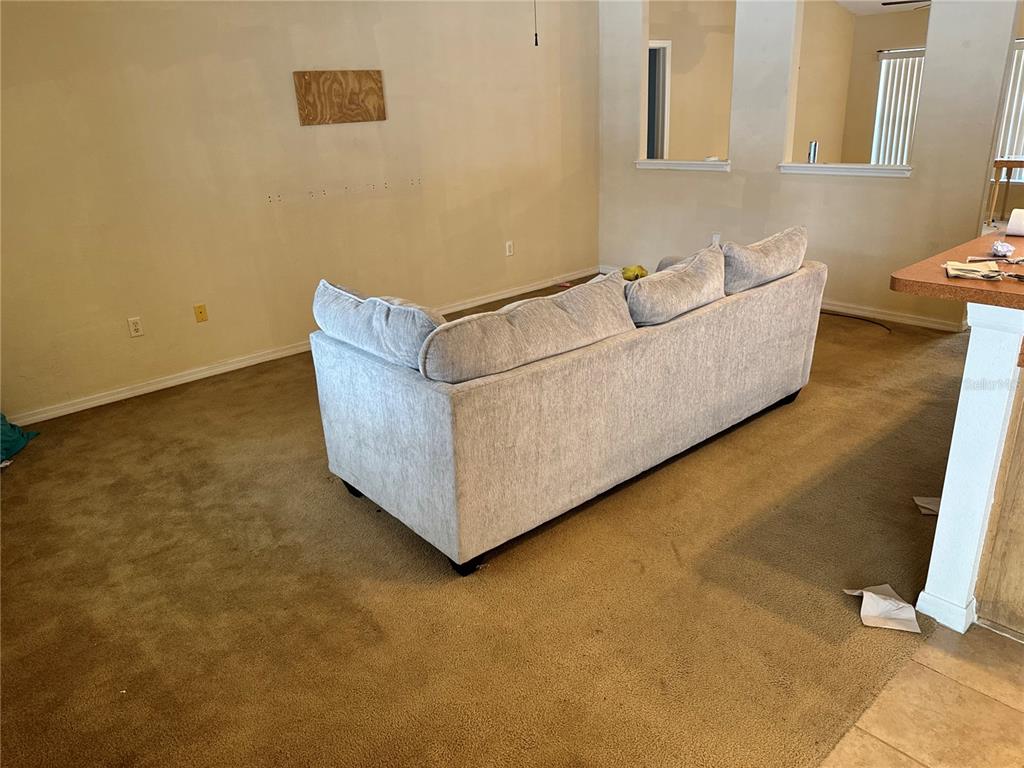 12055 Robina Road Weeki Wachee, FL 34614 - Photo 33 of 64 a living room with couch and a couch