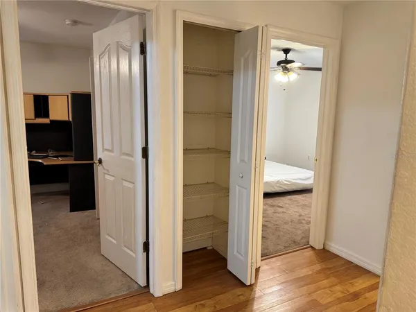 a living room with furniture and a kitchen view