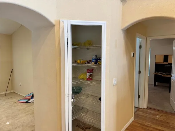 a room with gym equipment and a window