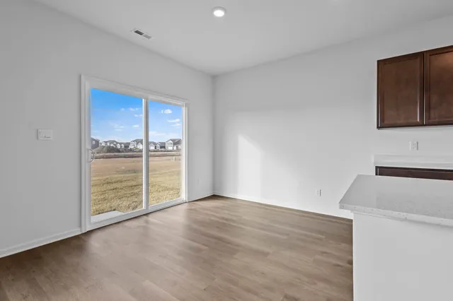 a bathroom with a sink double vanity and a window